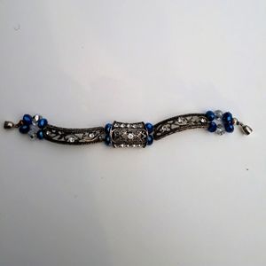 Stretchy Dark Metal Bracelet Blue And White Beads With Magnetic Closure